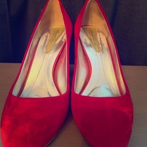 Red suede pumps